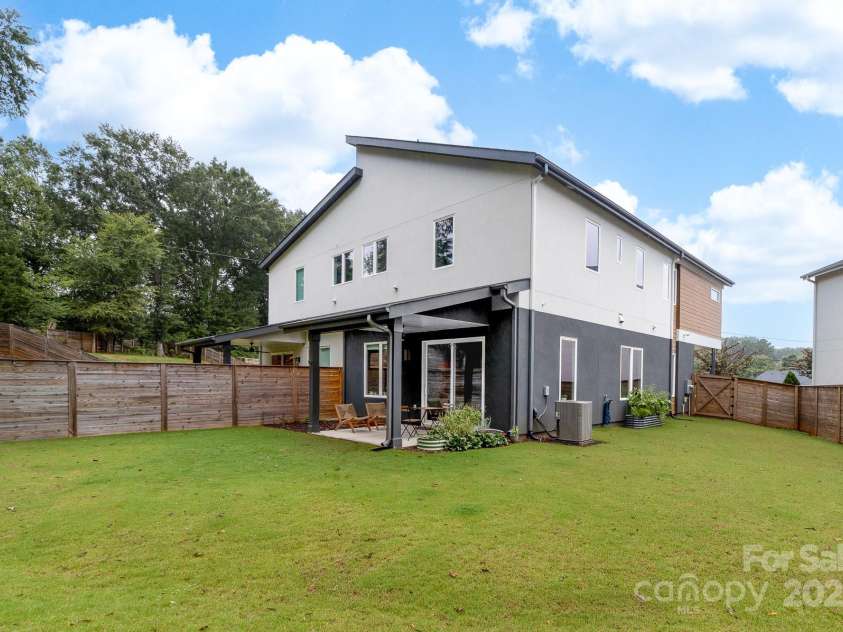 102 Mattoon Street, Charlotte, NC 28216.  MLS# CAR4291152, YatesRealty ID 33532. PLUS this backyard. We really need to talk more about it. FULLY FENCED IN, BIG, GRASS, AND raised garden beds are staying so you can really explore urban farming, which you said you wanted to try! Think about the money 