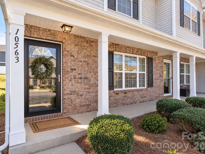 10563 Stoneacre Court, Pineville, NC 28134.  MLS# CAR4428184, YatesRealty ID 33537. Covered Front Porch - *Photo has been virtually enhanced