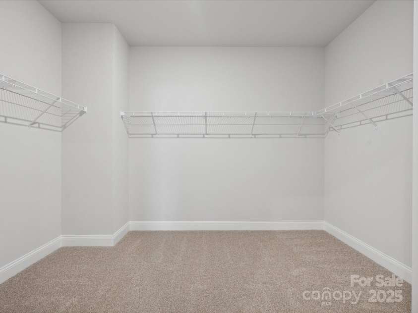 1051 Bull Dog Lane, Wingate, NC 28174.  MLS# CAR4183565, YatesRealty ID 3356. *Photo is for representational purposes only*Primary closet