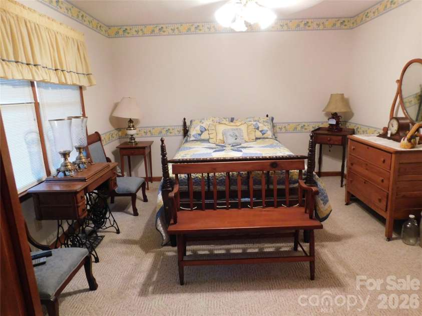 175 Briarfield Drive, Mooresville, NC 28115.  MLS# CAR4342091, YatesRealty ID 3356. 1st bedroom off of the hallway 14x12 holds nice large pieces of furniture. How will you design this one?