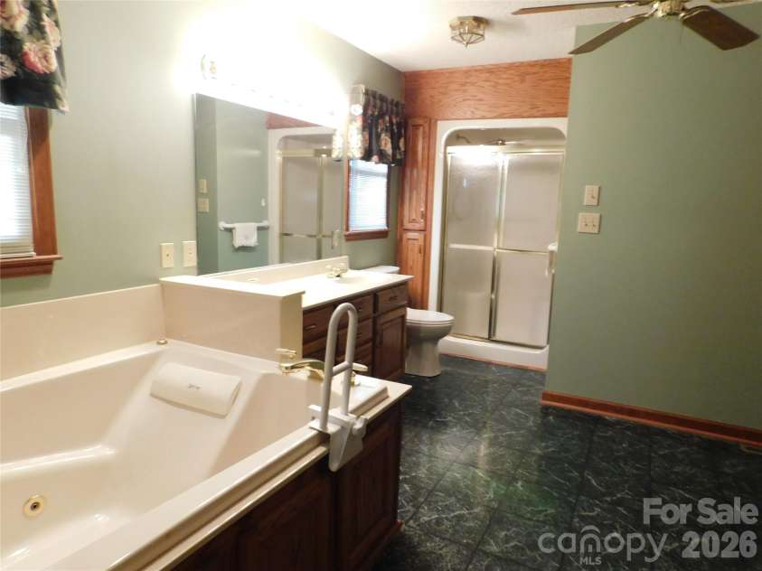 175 Briarfield Drive, Mooresville, NC 28115.  MLS# CAR4342091, YatesRealty ID 3356. Another view to show the complete primary suite bathroom layout. inside this bathroom is also a separate laundry room and walk in closet
