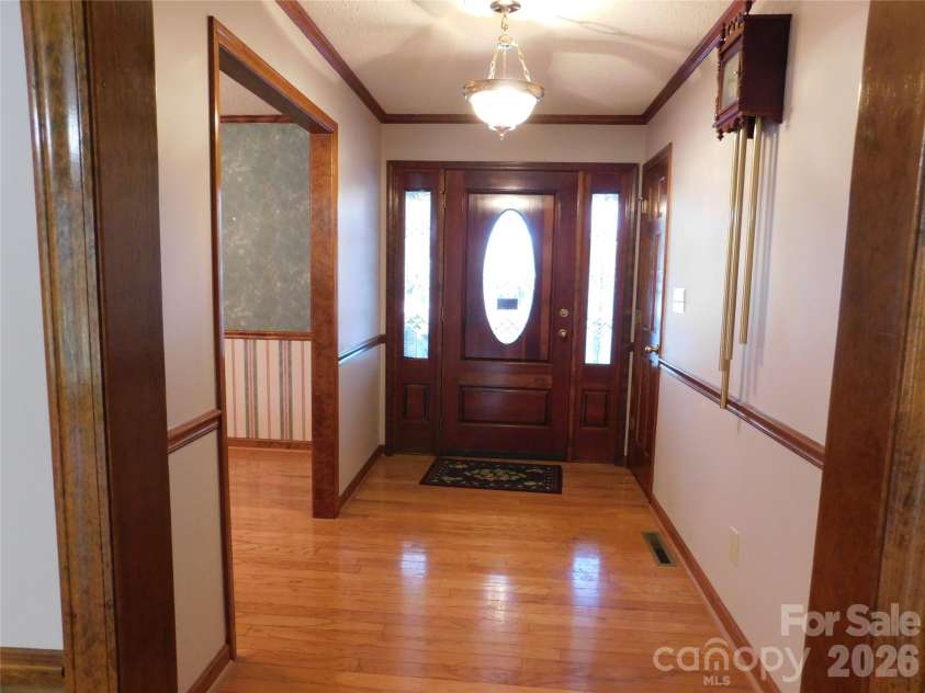 175 Briarfield Drive, Mooresville, NC 28115.  MLS# CAR4342091, YatesRealty ID 3356. Foyer has rich hardwoods, coat closet and antique door bell that may stay if not then it will be replaced prior to closing. Lets talk about it. 