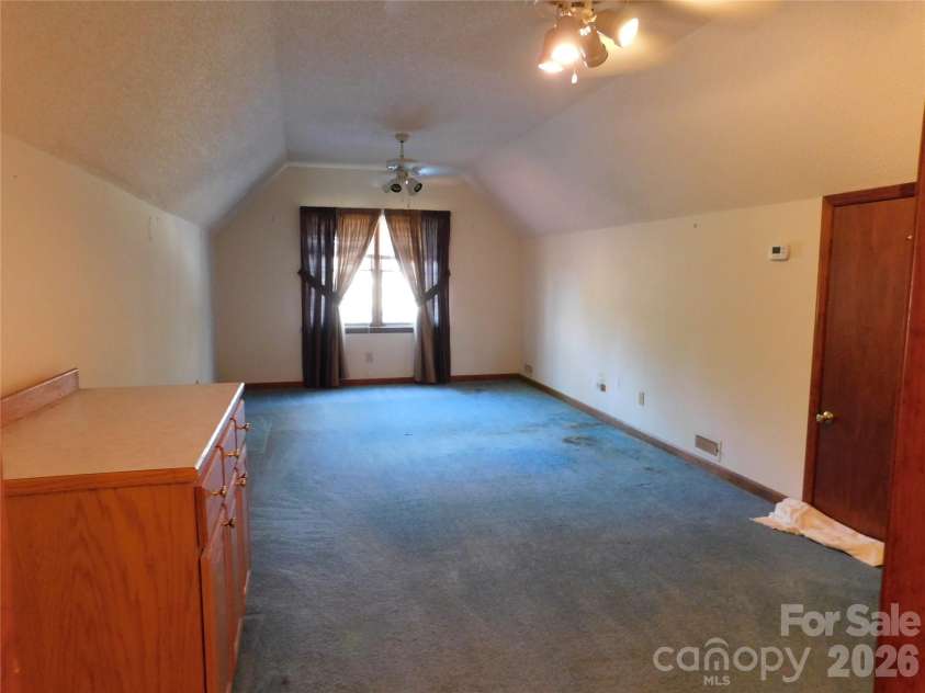 175 Briarfield Drive, Mooresville, NC 28115.  MLS# CAR4342091, YatesRealty ID 3356. Off of the study headed to the garage is a stairway that leads to the FLEX Room (door in photo is to attic access.)