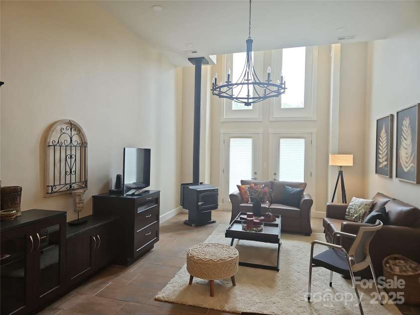 2905 Medlin Road, Monroe, NC 28112.  MLS# CAR4267802, YatesRealty ID 3356. Ample natural light  Note wood burning stove- Custom Builtin Cabinets