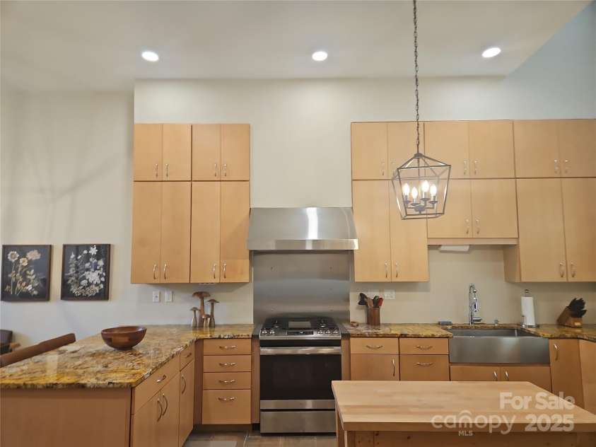2905 Medlin Road, Monroe, NC 28112.  MLS# CAR4267802, YatesRealty ID 3356. Soaring Custom Cabinets New Lighting Throughout