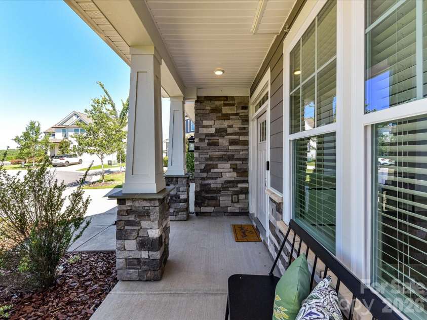 6203 Six String Court, Fort Mill, SC 29708.  MLS# CAR4385679, YatesRealty ID 33567. Covered Front Porch Large enough for your Rocking Chairs