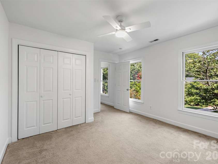 6912 Foxglove Drive, Charlotte, NC 28226.  MLS# CAR4394757, YatesRealty ID 33579. 3rd bedroom with new ceiling fan!