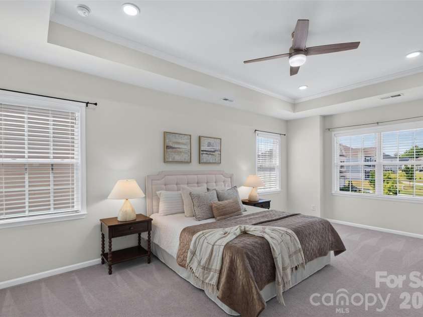 2249 Idol Rock Drive, Fort Mill, SC 29707.  MLS# CAR4396380, YatesRealty ID 33582. Luxurious primary bedroom with tray ceiling