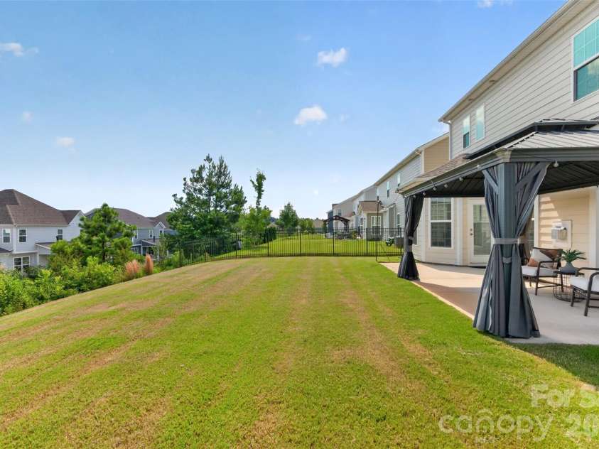 2249 Idol Rock Drive, Fort Mill, SC 29707.  MLS# CAR4396380, YatesRealty ID 33582. View from side of back yard