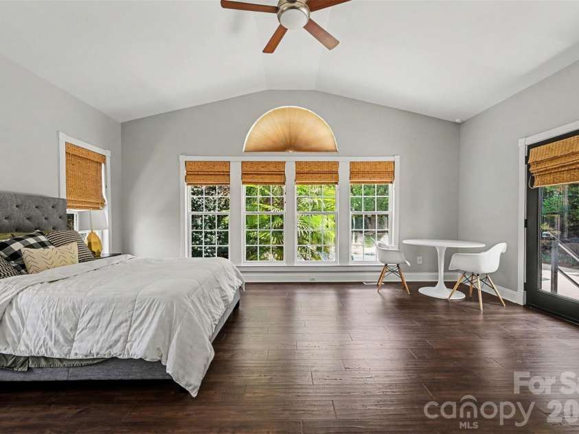 2442 Smith Cove Road, Denver, NC 28037.  MLS# CAR4396728, YatesRealty ID 33588. Main level primary suite. So much light and what a view from this room!