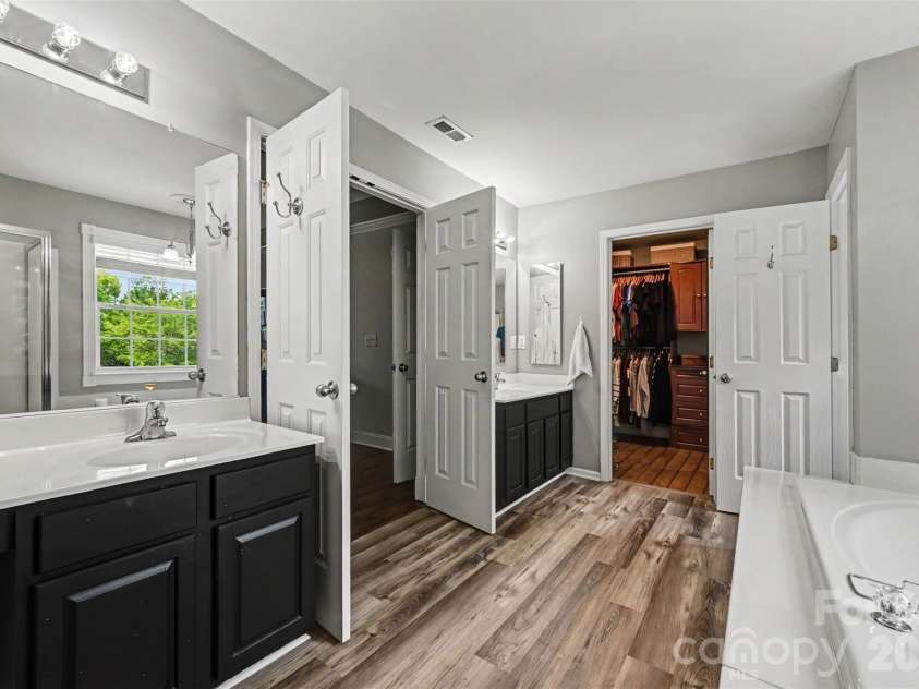 2442 Smith Cove Road, Denver, NC 28037.  MLS# CAR4396728, YatesRealty ID 33588. Upper primary bathroom with dual vanities.
