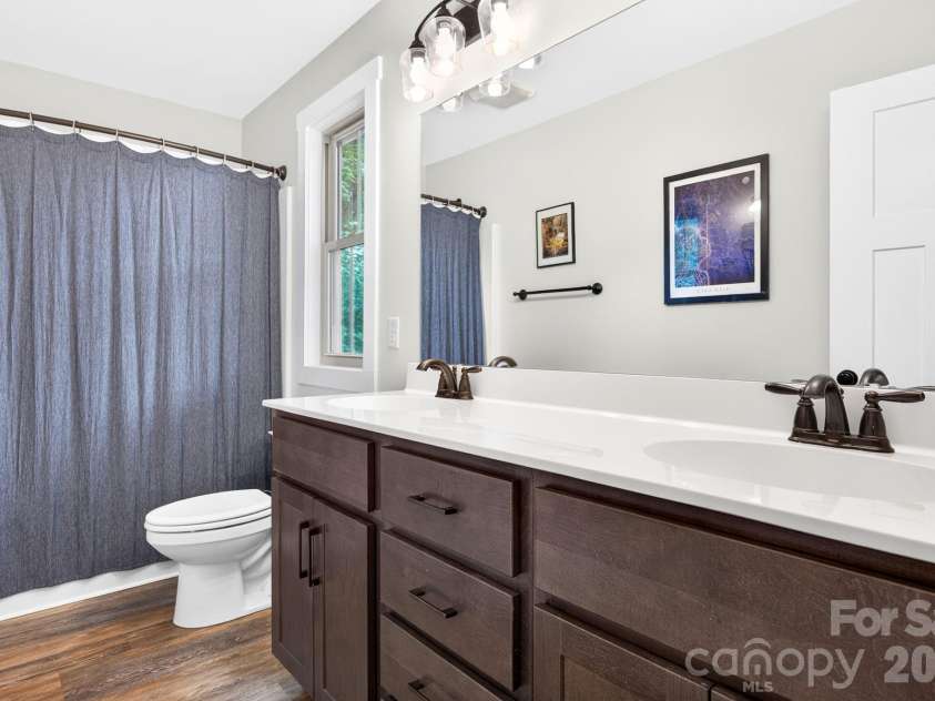 58 Shuler Road, Candler, NC 28715.  MLS# CAR4396934, YatesRealty ID 33589. Ensuite Bath has Double Vanity and Shower/Tub Combo
