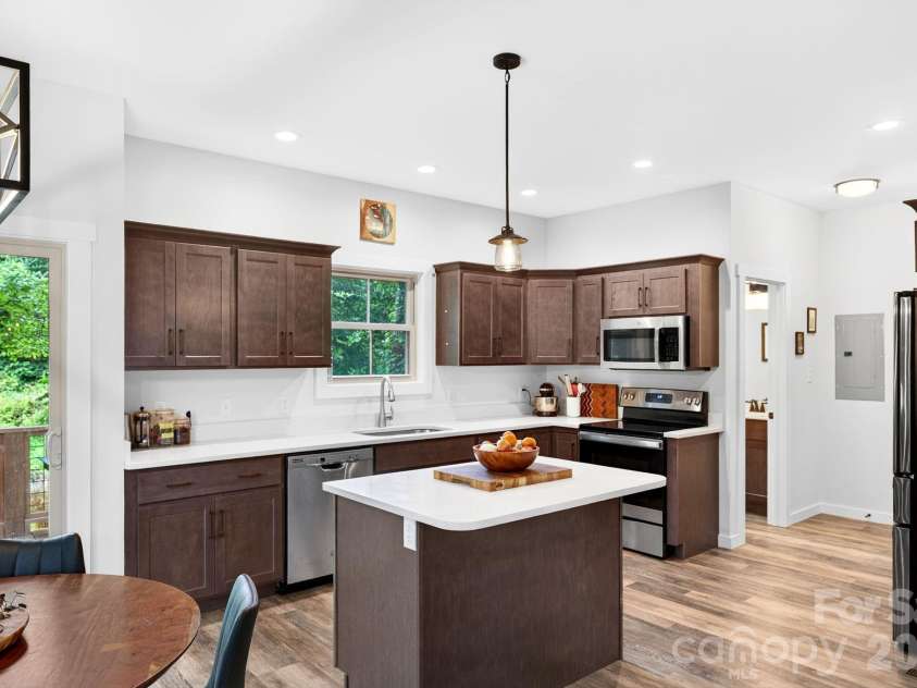 58 Shuler Road, Candler, NC 28715.  MLS# CAR4396934, YatesRealty ID 33589. Kitchen Window Looks Out to Private Backyard