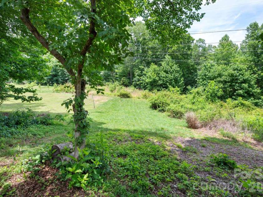 58 Shuler Road, Candler, NC 28715.  MLS# CAR4396934, YatesRealty ID 33589. Surrounded by Trees in Back...