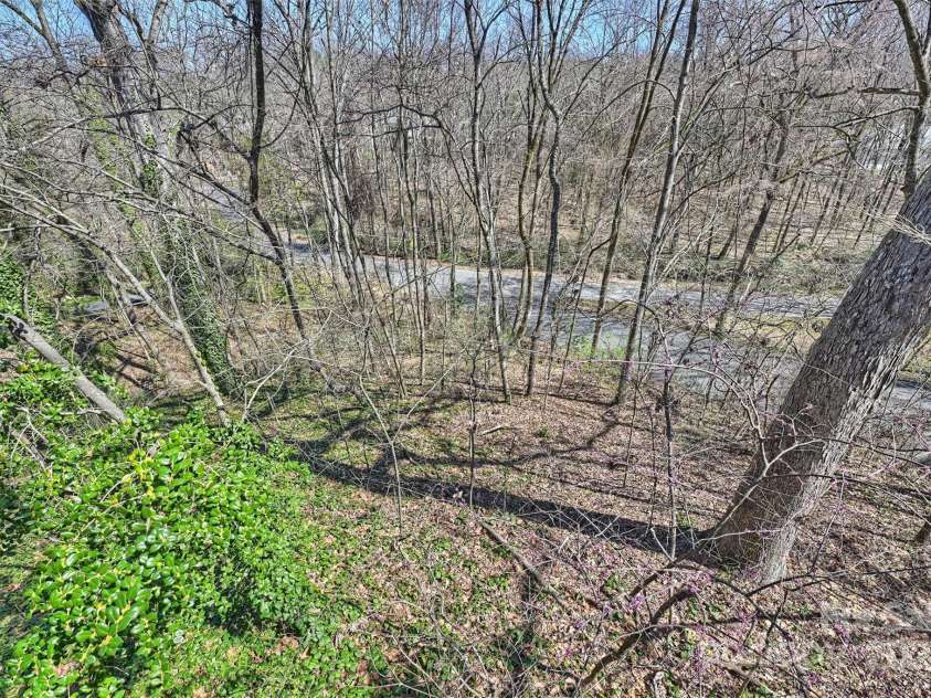 6366 Sharon Hills Road, Charlotte, NC 28210.  MLS# CAR4228866, YatesRealty ID 3359. Home sits on a .78 wooded and private lot