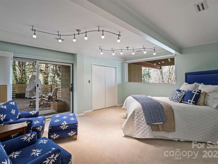 6366 Sharon Hills Road, Charlotte, NC 28210.  MLS# CAR4228866, YatesRealty ID 3359. Lower level bedroom with backyard access
