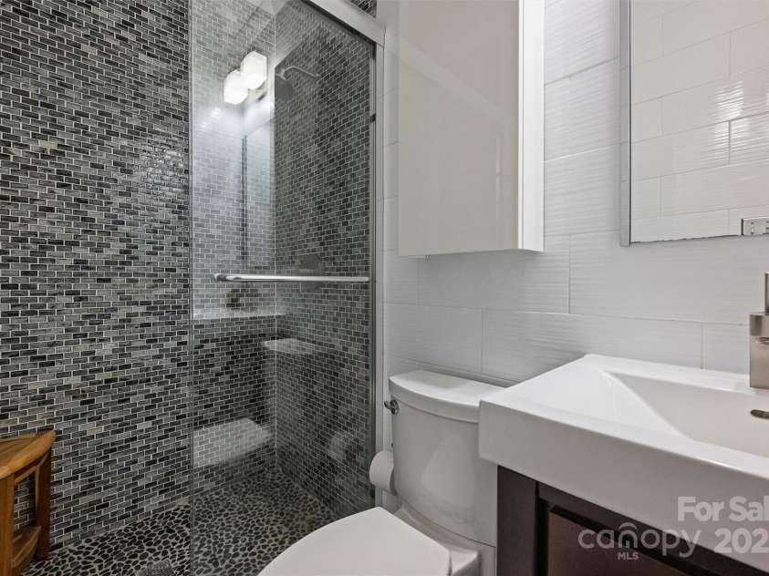 6366 Sharon Hills Road, Charlotte, NC 28210.  MLS# CAR4228866, YatesRealty ID 3359. Lower level full bathroom