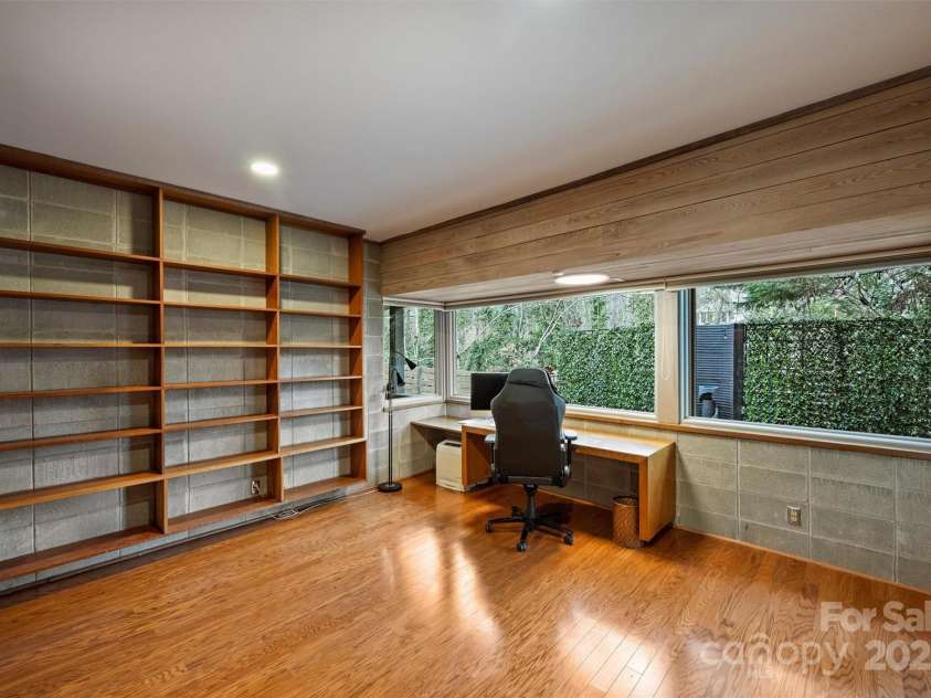 6366 Sharon Hills Road, Charlotte, NC 28210.  MLS# CAR4228866, YatesRealty ID 3359. Lower level study with floating desk and shelves