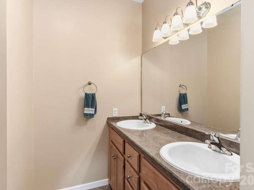 13 Triple H Drive, Asheville, NC 28806.  MLS# CAR4396514, YatesRealty ID 33591. Ensuite Full Bath with Double Vanity