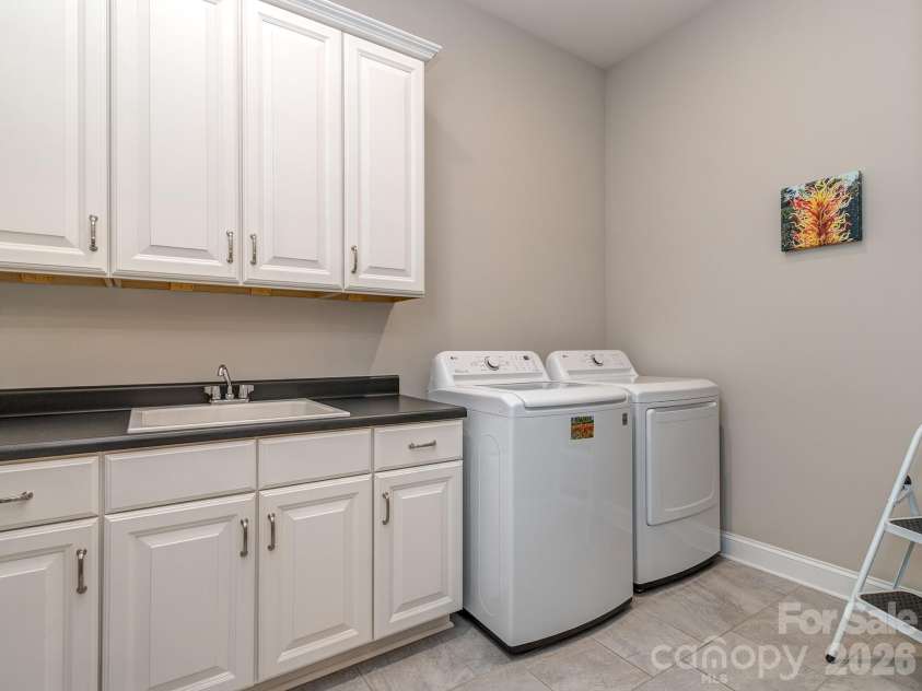 121 Enclave Boulevard, Weddington, NC 28104.  MLS# CAR4395615, YatesRealty ID 33597. Main floor laundry
