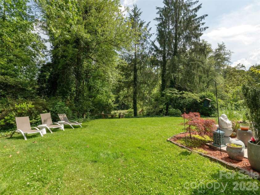30 Fairway Drive, Etowah, NC 28729.  MLS# CAR4342625, YatesRealty ID 3360. Beautiful gardens