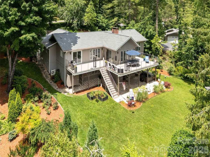 30 Fairway Drive, Etowah, NC 28729.  MLS# CAR4342625, YatesRealty ID 3360. Exterior showing spacious deck and patio