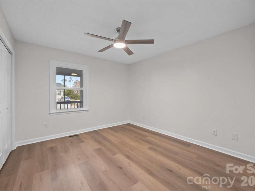 322 57th Street, Oak Island, NC 28465.  MLS# CAR4354711, YatesRealty ID 33606. Bedroom #2 Featuring a new ceiling fan.