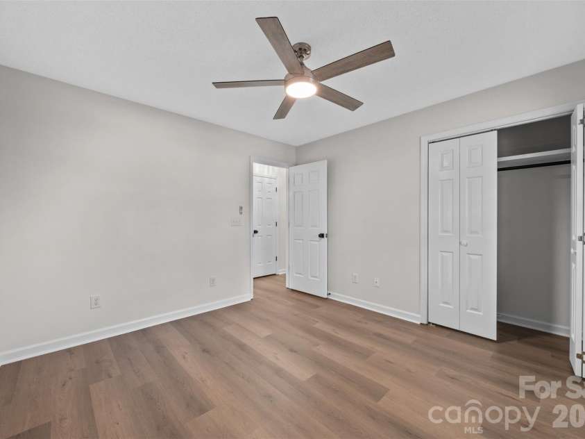 322 57th Street, Oak Island, NC 28465.  MLS# CAR4354711, YatesRealty ID 33606. Bedroom #2 with a generous sized closet.