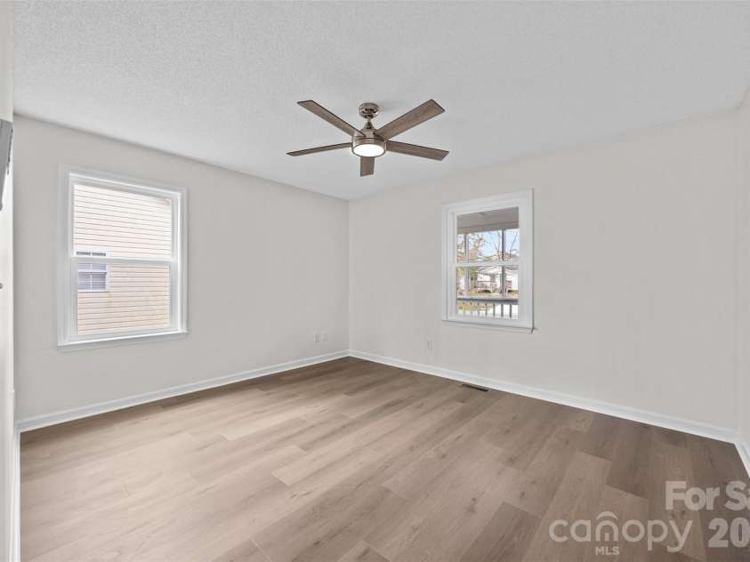 322 57th Street, Oak Island, NC 28465.  MLS# CAR4354711, YatesRealty ID 33606. Bedroom #3 featuring a new ceiling fan.