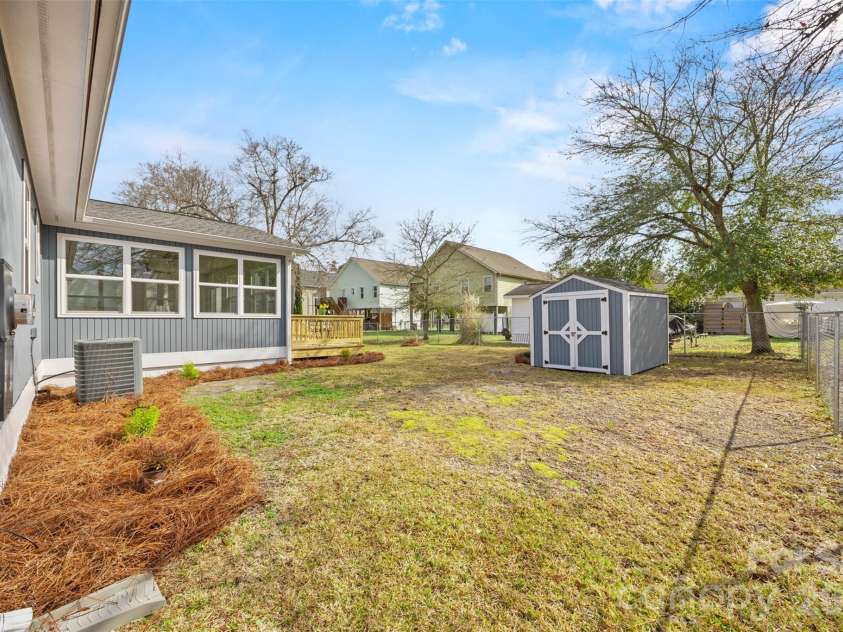 322 57th Street, Oak Island, NC 28465.  MLS# CAR4354711, YatesRealty ID 33606. Fully fenced in back yard.