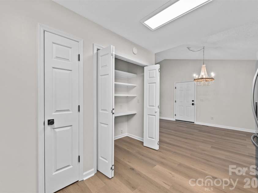 322 57th Street, Oak Island, NC 28465.  MLS# CAR4354711, YatesRealty ID 33606. Kitchen featuring a generous sized pantry.