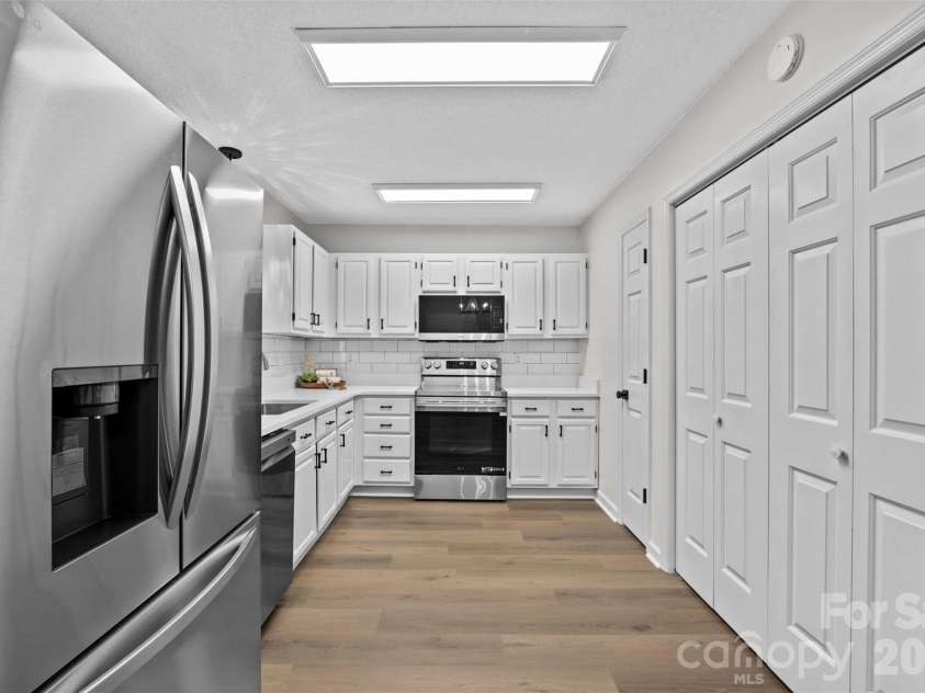 322 57th Street, Oak Island, NC 28465.  MLS# CAR4354711, YatesRealty ID 33606. Kitchen featuring new LG appliances.