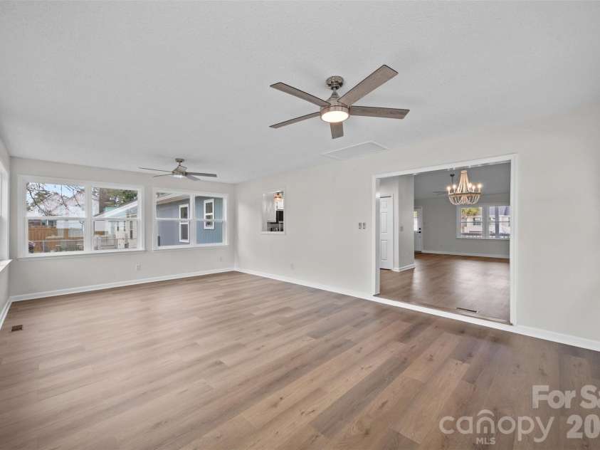 322 57th Street, Oak Island, NC 28465.  MLS# CAR4354711, YatesRealty ID 33606. Sunroom features two new ceiling fans