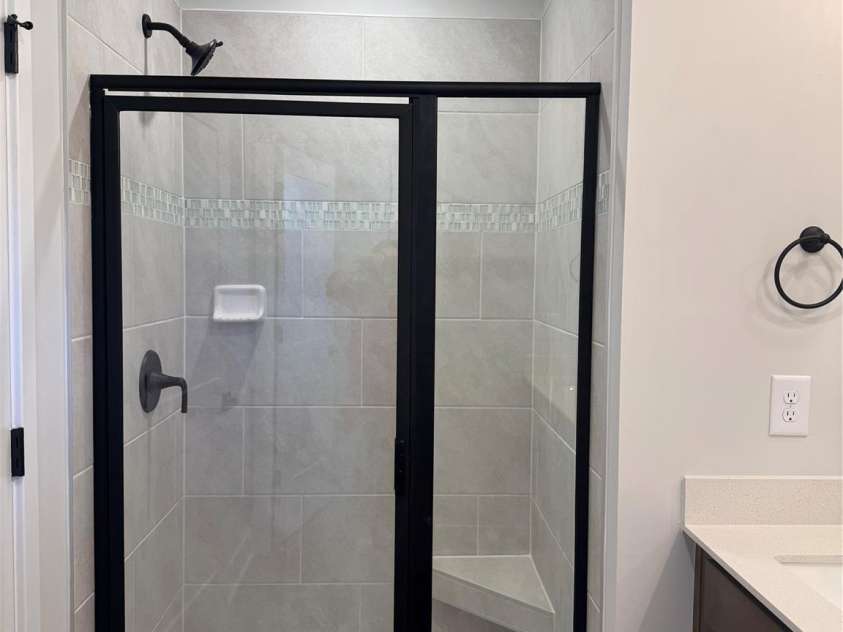 716 Pinecone Drive, Gastonia, NC 28056.  MLS# CAR4341021, YatesRealty ID 33608. Primary bathroom tile shower