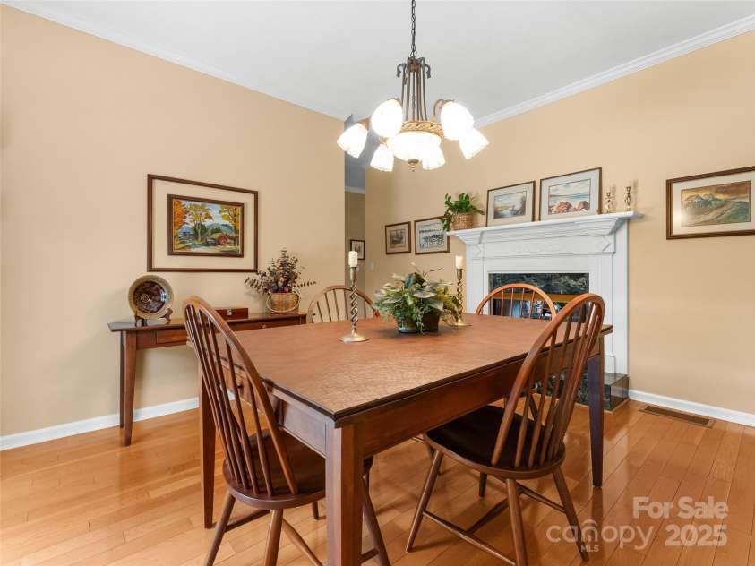35 Beaumont Drive, Hendersonville, NC 28739.  MLS# CAR4293793, YatesRealty ID 33609. Dining Room w/ fireplace
