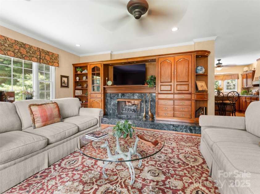 35 Beaumont Drive, Hendersonville, NC 28739.  MLS# CAR4293793, YatesRealty ID 33609. LR w/ fireplace & Built-ins