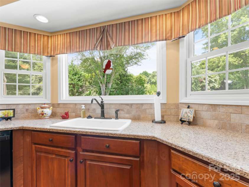 35 Beaumont Drive, Hendersonville, NC 28739.  MLS# CAR4293793, YatesRealty ID 33609. Picture window overlooking back yard