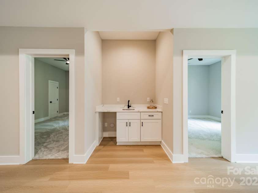 4028 Spindrift Cove Drive, Denver, NC 28037.  MLS# CAR4270075, YatesRealty ID 33617. A stunning, secondary Wet Bar with ice maker (now installed) for entertaining in the Living Room of the Lower Level