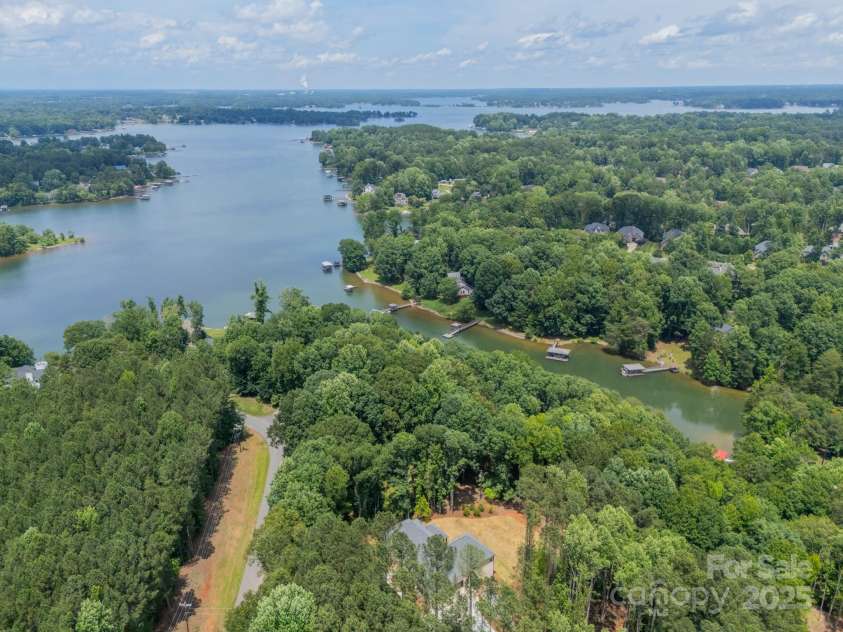 4028 Spindrift Cove Drive, Denver, NC 28037.  MLS# CAR4270075, YatesRealty ID 33617. Enjoy the gorgeous lake lifestyle living on Lake Norman in this private, stunning Estate on over 2.03 acres!