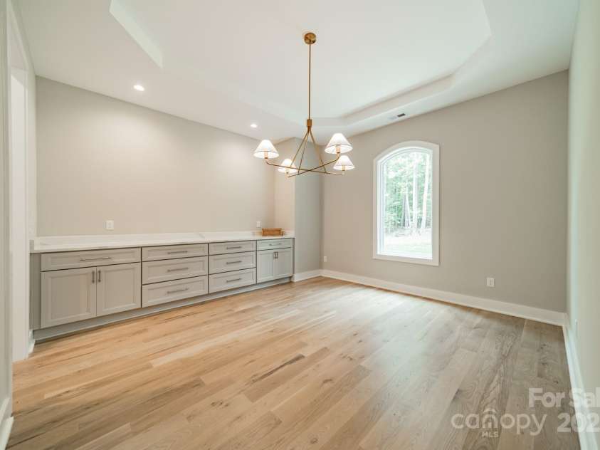 4028 Spindrift Cove Drive, Denver, NC 28037.  MLS# CAR4270075, YatesRealty ID 33617. Entertain in Style in the grand Dining Room with built-in Cabinetry and Quartz Countertops