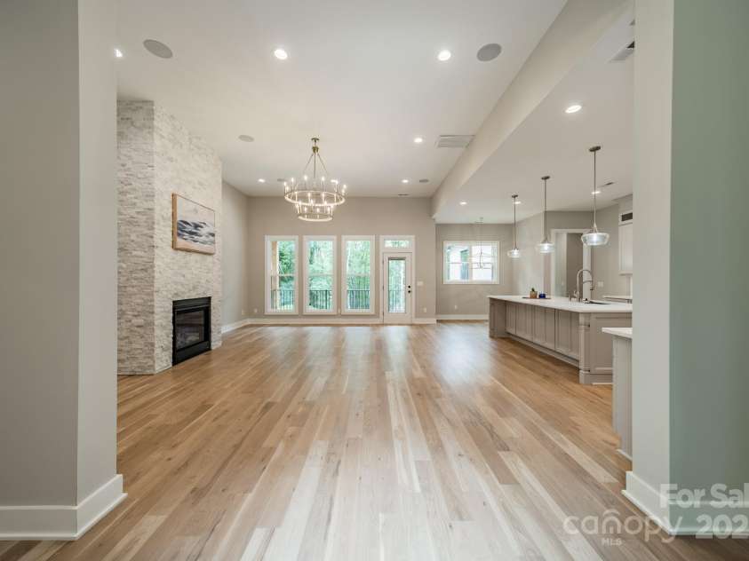 4028 Spindrift Cove Drive, Denver, NC 28037.  MLS# CAR4270075, YatesRealty ID 33617. Gorgeous Open Concept Living overlooking Lake Norman with 12 foot ceilings and a stunning stacked stone fireplace