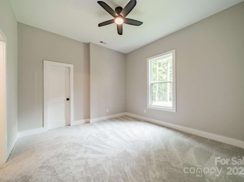4028 Spindrift Cove Drive, Denver, NC 28037.  MLS# CAR4270075, YatesRealty ID 33617. Lower Level Bedroom 4 boast a walk-in closet and faces Lake Norman