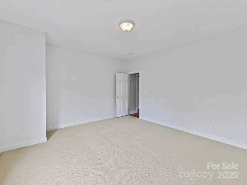 7717 Quail Park Drive, Charlotte, NC 28210.  MLS# CAR4289882, YatesRealty ID 33625. Bedroom with ensuite