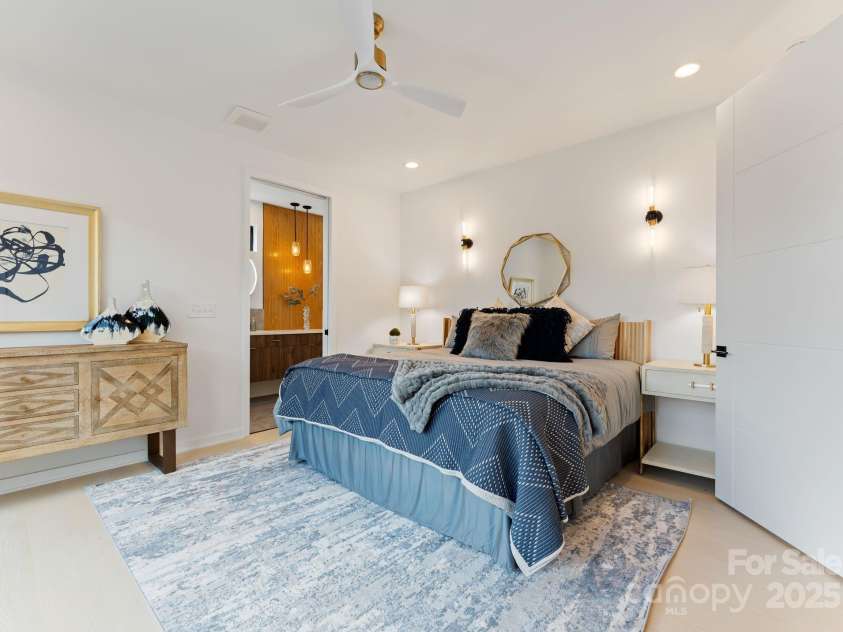 412 State Street, Charlotte, NC 28208.  MLS# CAR4273285, YatesRealty ID 33628. Primary bedroom with sconce lighting.
