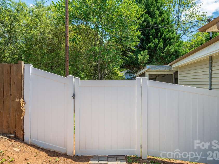 58 4th Street, Cramerton, NC 28032.  MLS# CAR4392035, YatesRealty ID 33628. Entrance to Back Yard