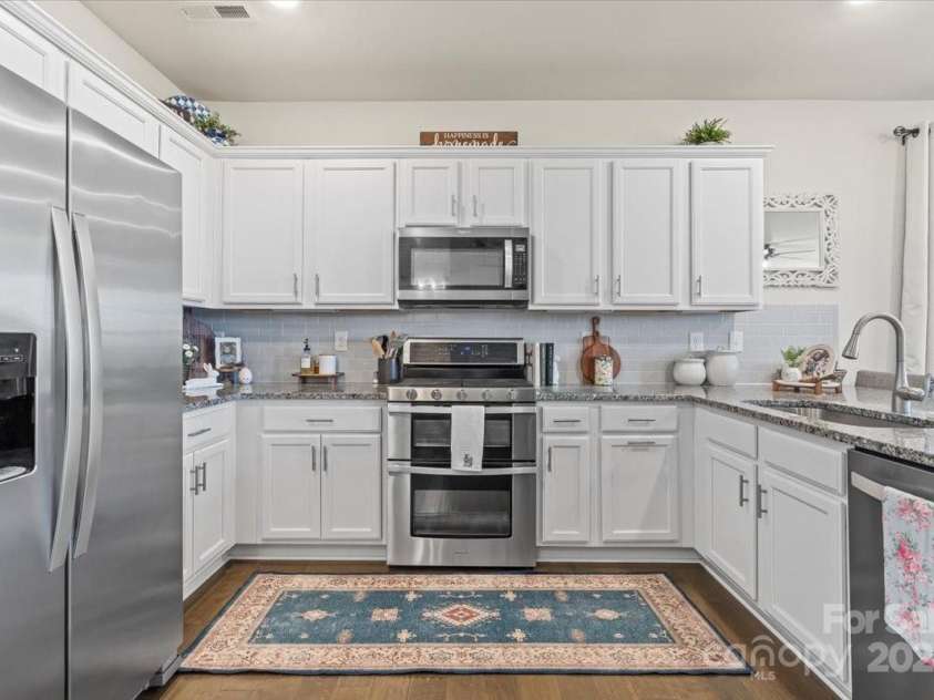 2147 Stevens Mill Road, Matthews, NC 28104.  MLS# CAR4231324, YatesRealty ID 3363. 