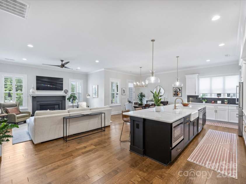 13627 Tranquil Day Drive, Matthews, NC 28105.  MLS# CAR4285895, YatesRealty ID 33636. Kitchen and Living Room