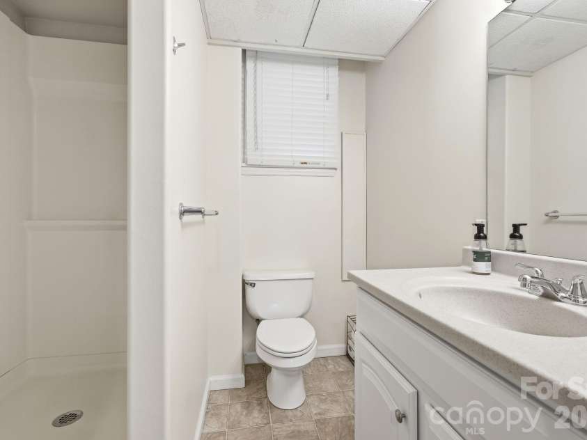 23 Warwick Place, Asheville, NC 28804.  MLS# CAR4394325, YatesRealty ID 33637. The basement bath.