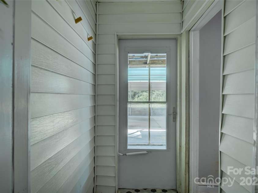 2111 Hodgin Street, Gastonia, NC 28056.  MLS# CAR4289182, YatesRealty ID 33638. Back door entry to screened porch