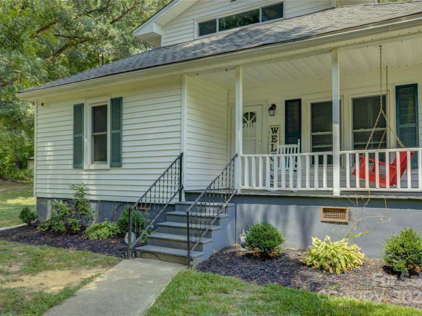 2111 Hodgin Street, Gastonia, NC 28056.  MLS# CAR4289182, YatesRealty ID 33638. Rocking chair front porch to welcome you home